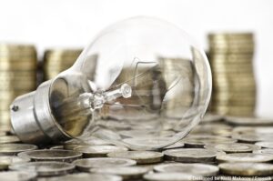 filament-bulb-lying-euro-coins_kl-300x199 filament bulb lying on euro coins